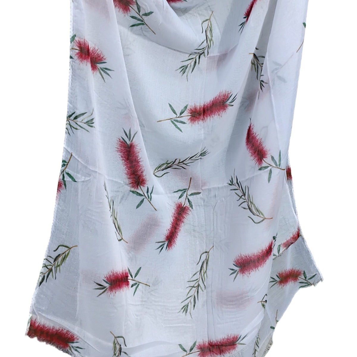 White scarf with red floral pattern draped