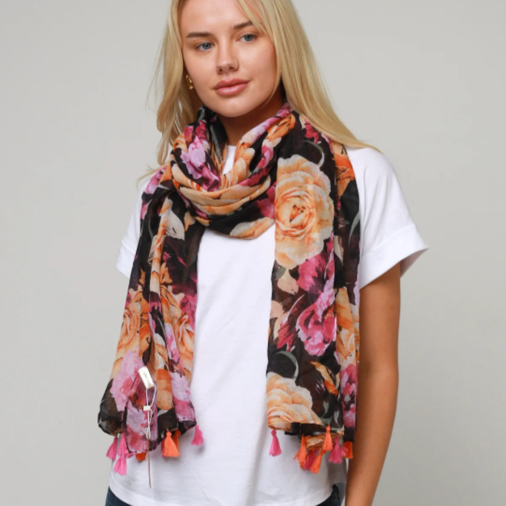 A pretty ladies scarf with large apricot and pink roses on a black background
