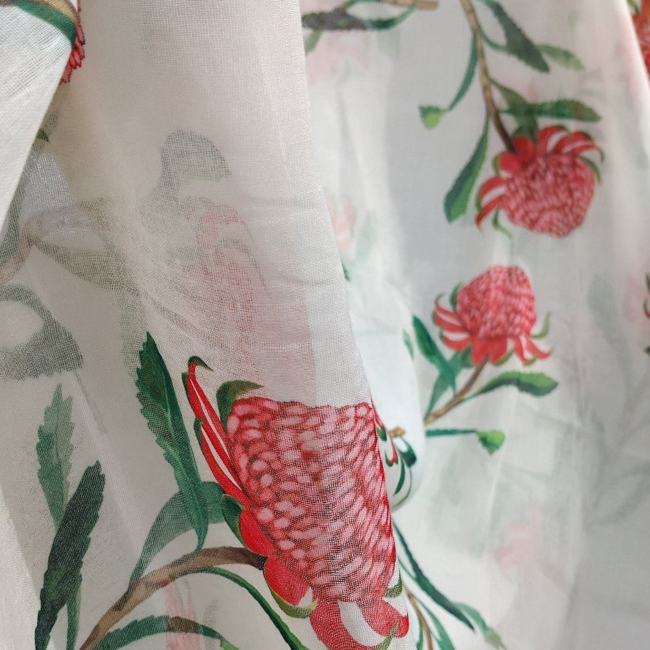 Floral fabric with red and pink flowers on a beige background