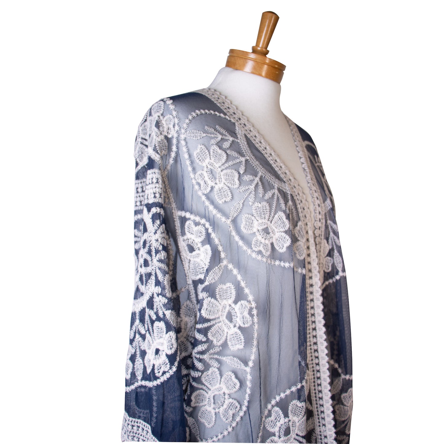 Mannequin wearing a navy blue lace kimono with a white floral pattern on a white background