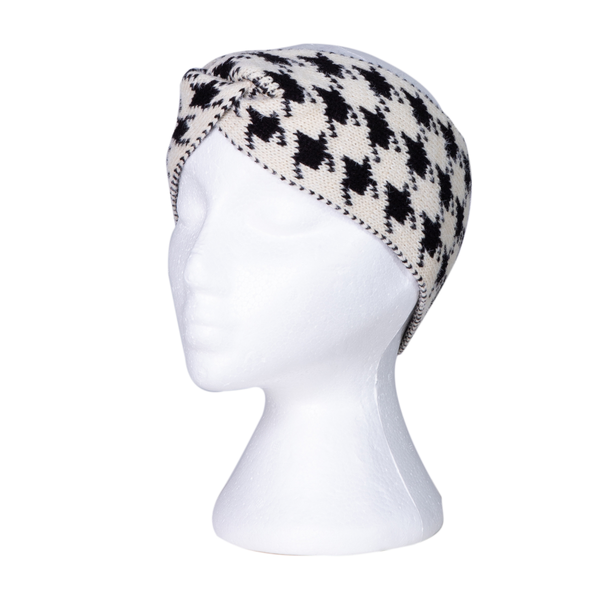 Cream and black houndstooth knitted beanie on a mannequin head against a white background