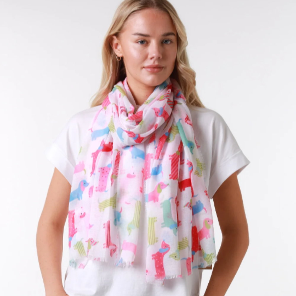 a colourful ladies scarf with cute dachshund dogs