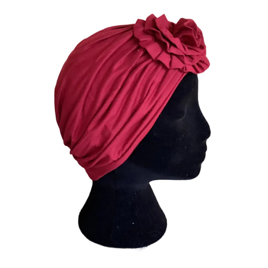 Red hair turban on a black head mannequin
