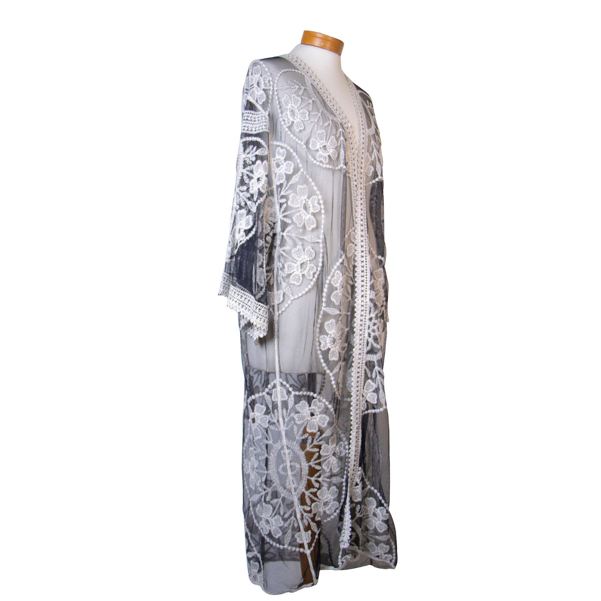 Lace dress on a mannequin against a white background