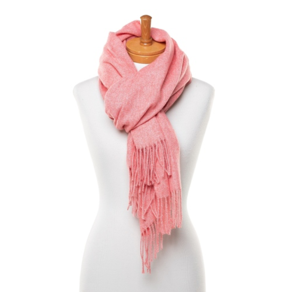 A soft and warm ladies scarf that is plain watermelon pink colour and has tassels. The scarf is very soft and warm and is tied around the neck of a mannequin.