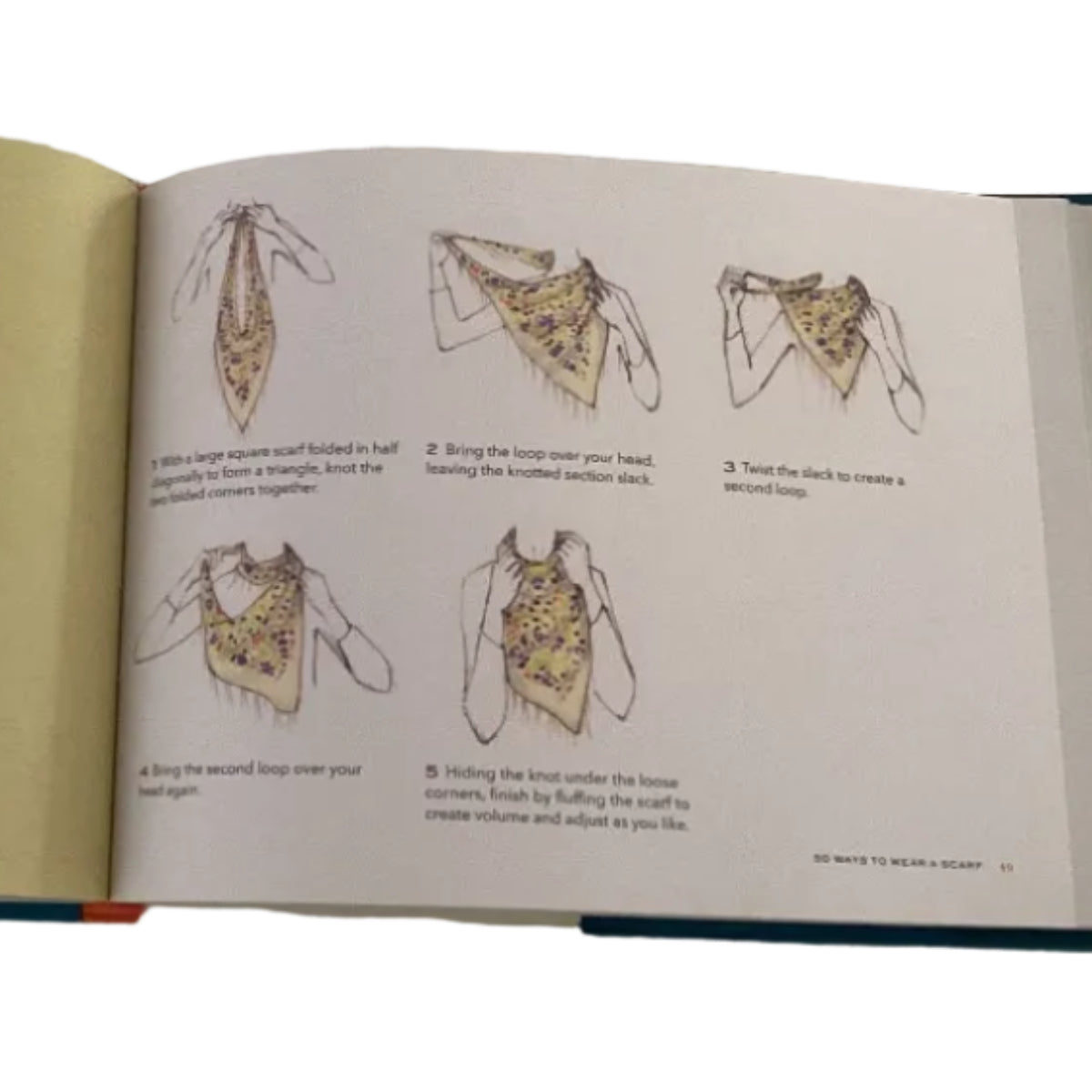 Open book on a textured white surface with illustrations and text.