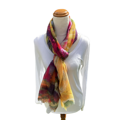 Mannequin wearing a colorful scarf with a white shirt on a white background