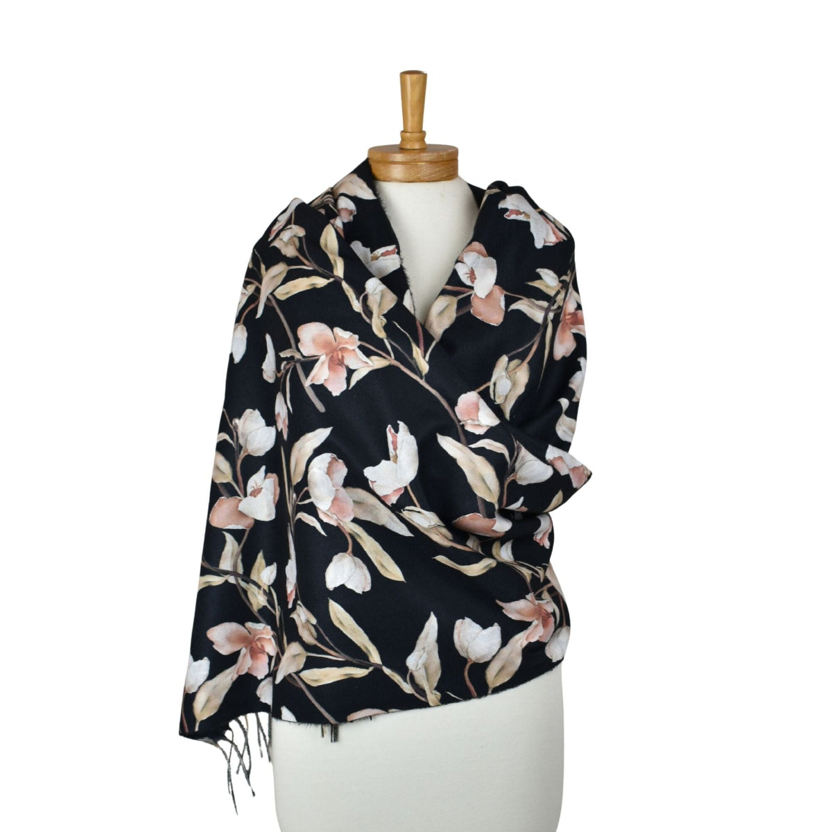 Floral patterned scarf on a mannequin against a white background