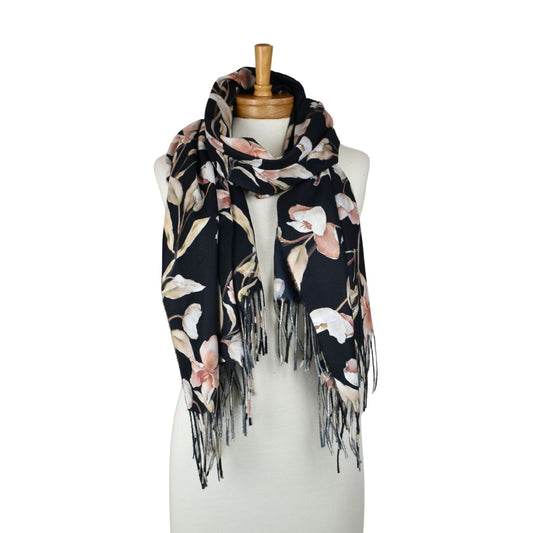 Floral patterned scarf with fringes on a mannequin against a white background