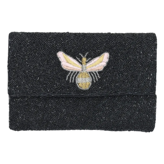 Black beaded clutch with a bee design on a white background