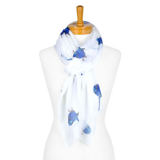 A cotton ladies scarf that has a white background and medium sized blue Splendid Fairy Wrens. The scarf is tied onto a mannequin.