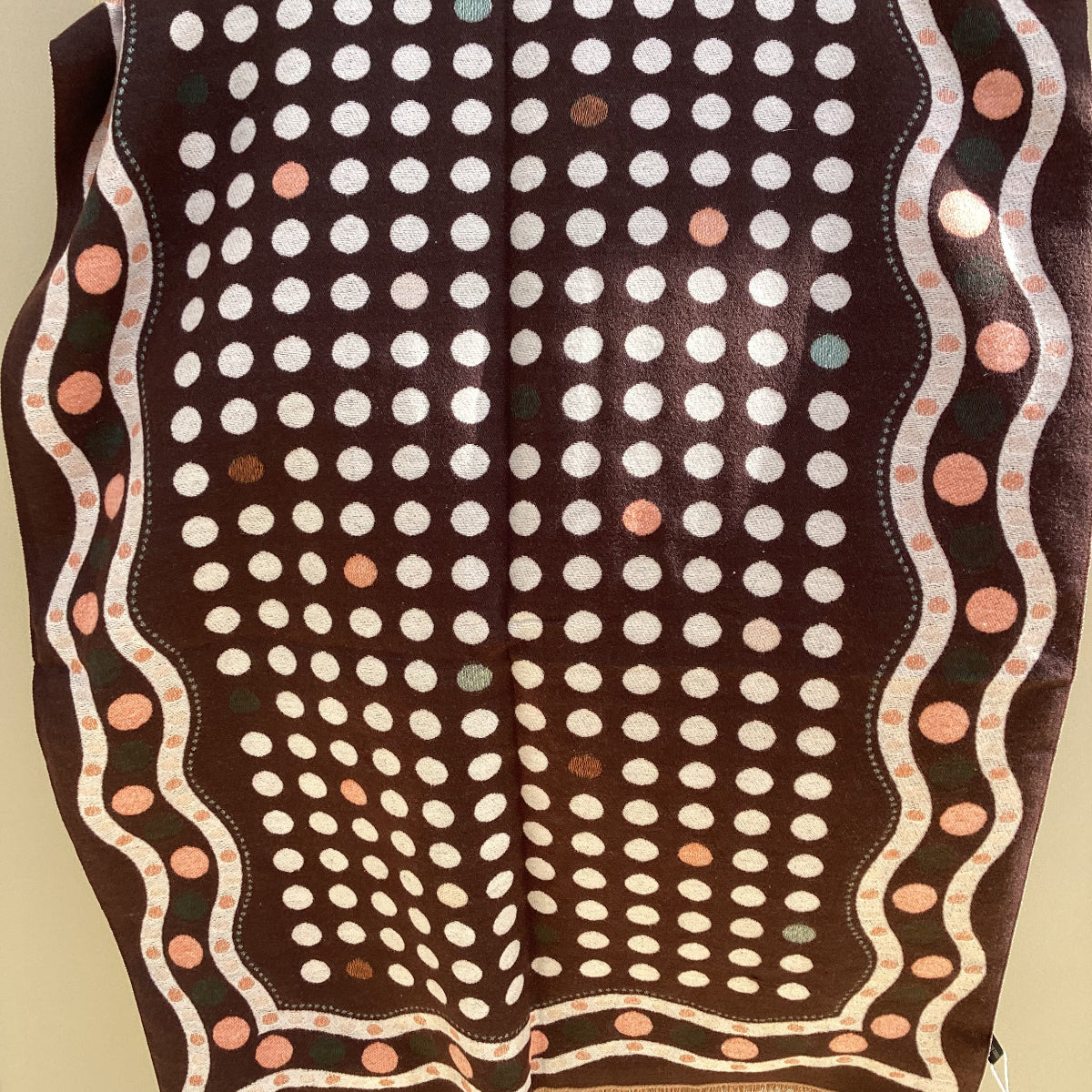 Polka dot scarf hanging on a chair