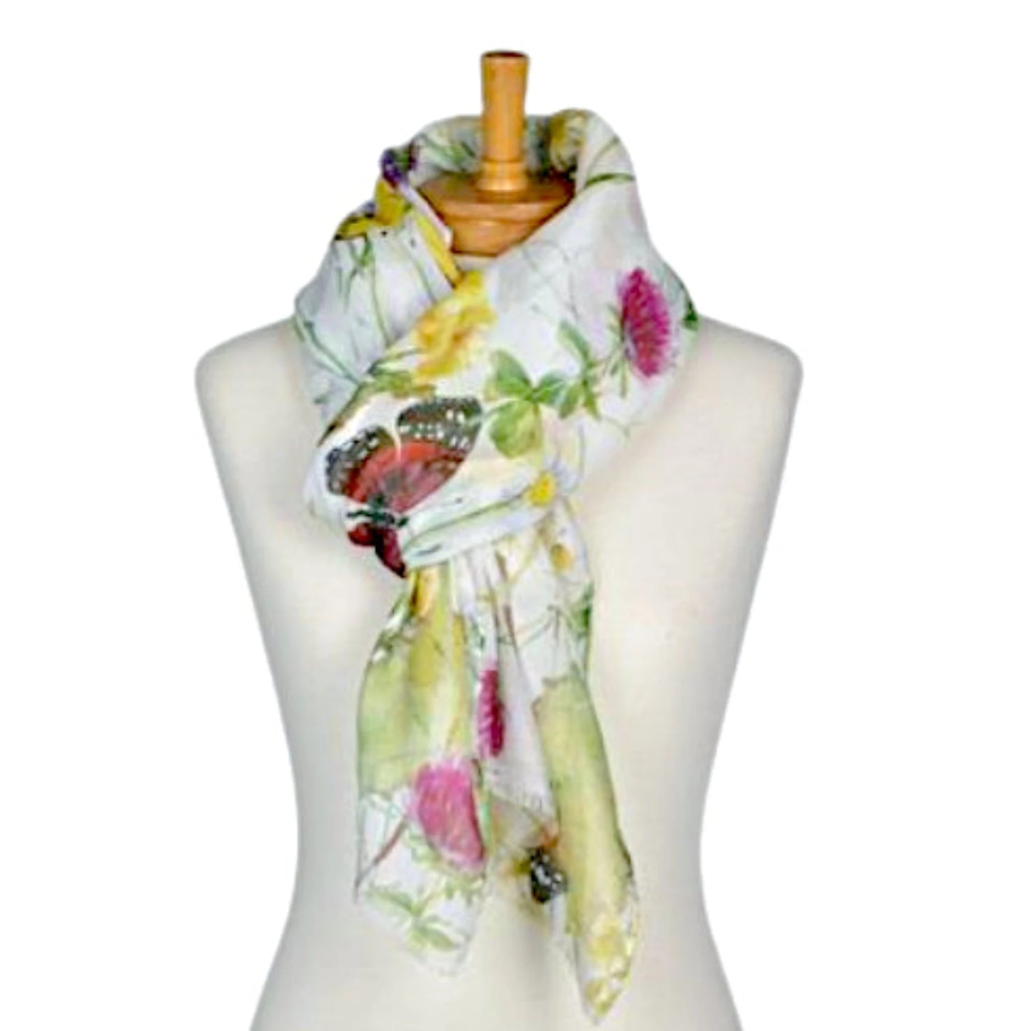 a ladies scarf that has a white background with a pattern of large red and yellow butterflies, flowers in colours of pink and yellow and green leaves.