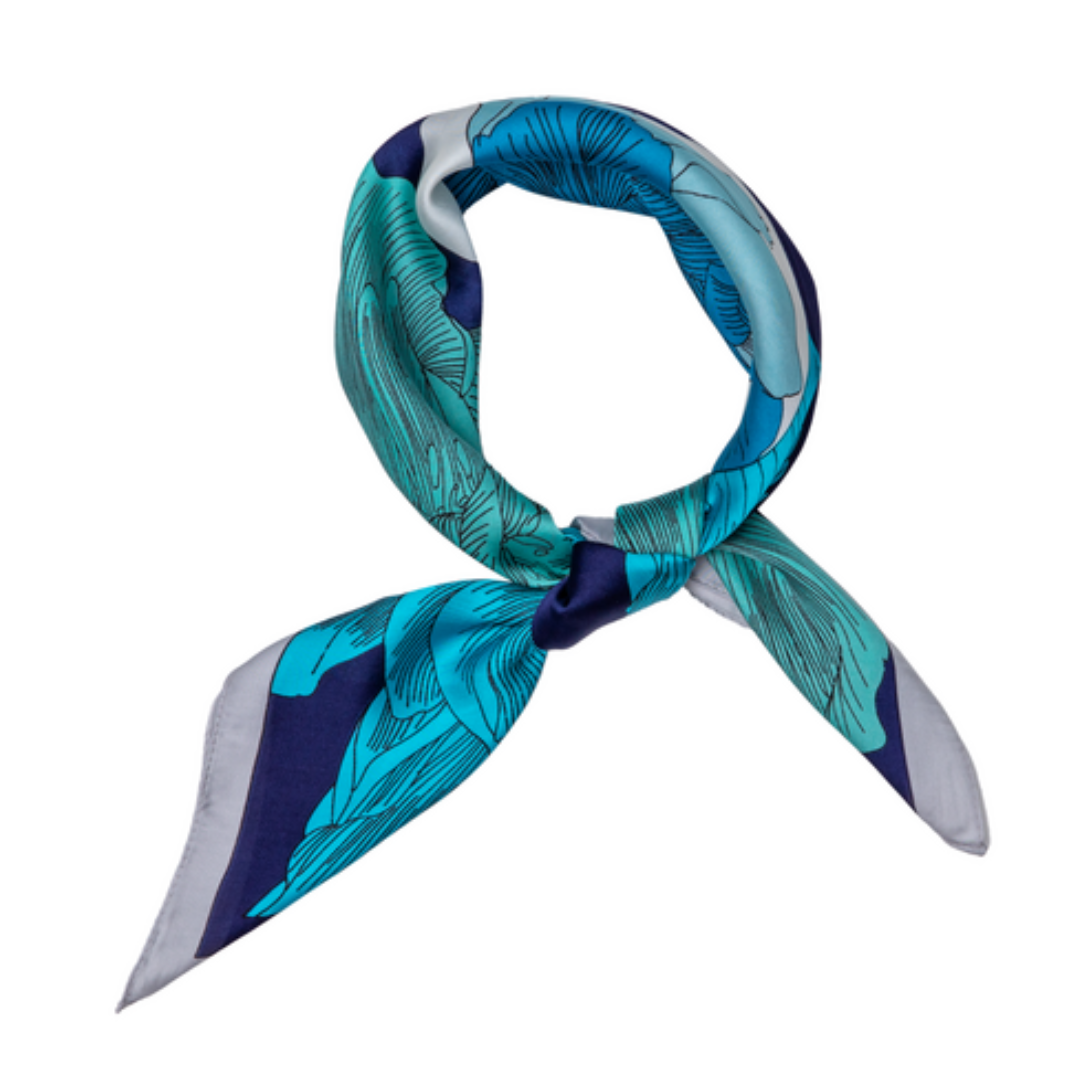 a square silk feeling ladies scarf that has bright blue flowers with a navy background and silver coloured border