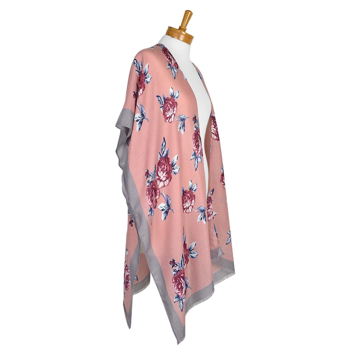 Floral patterned scarf on a mannequin against a white background
