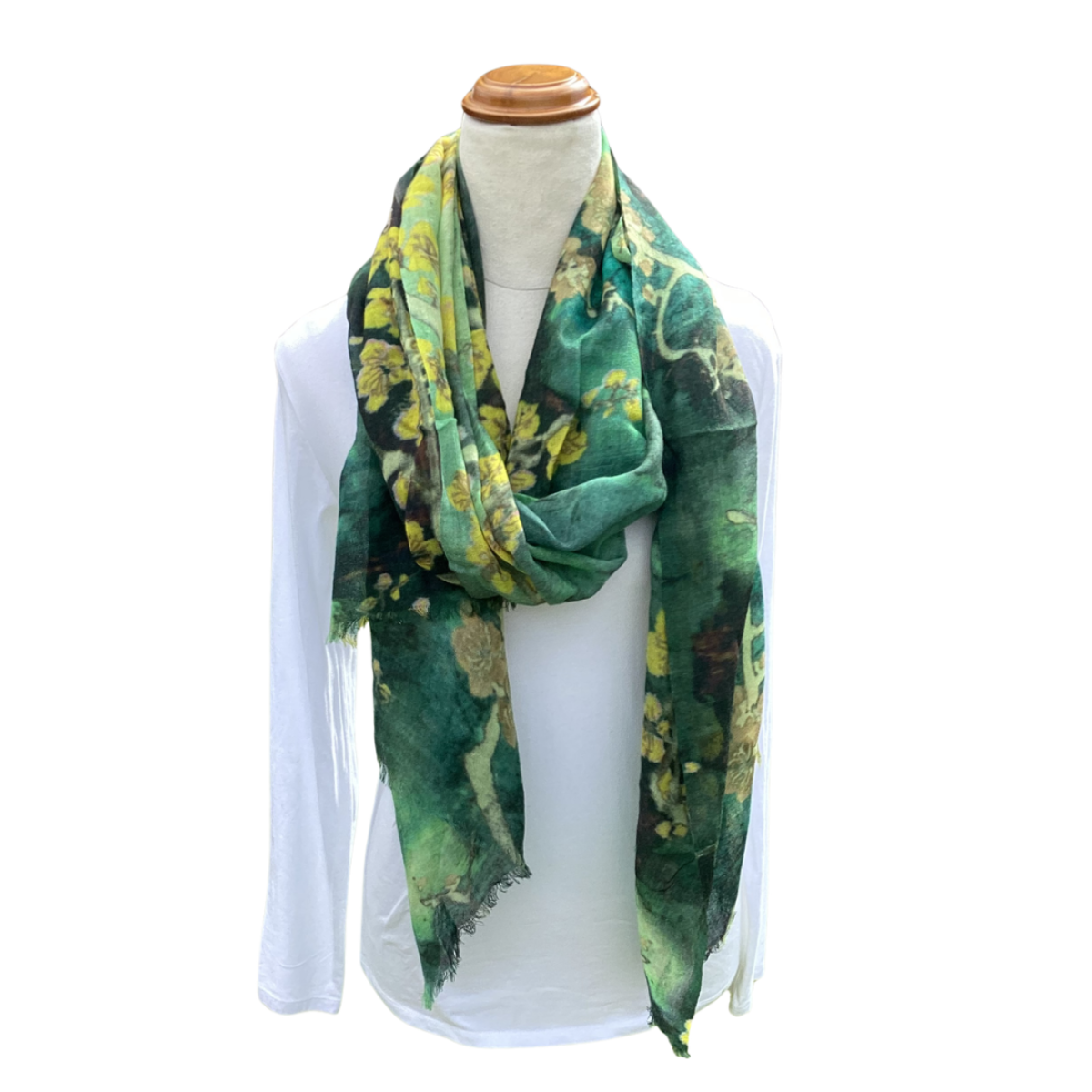 Green floral patterned scarf on a mannequin with a white background