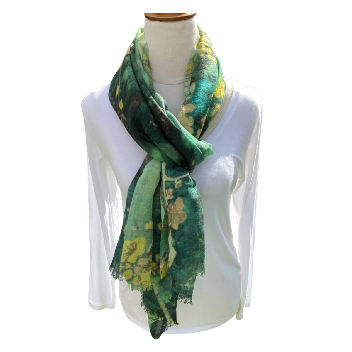 Green floral patterned scarf on a mannequin with a white background