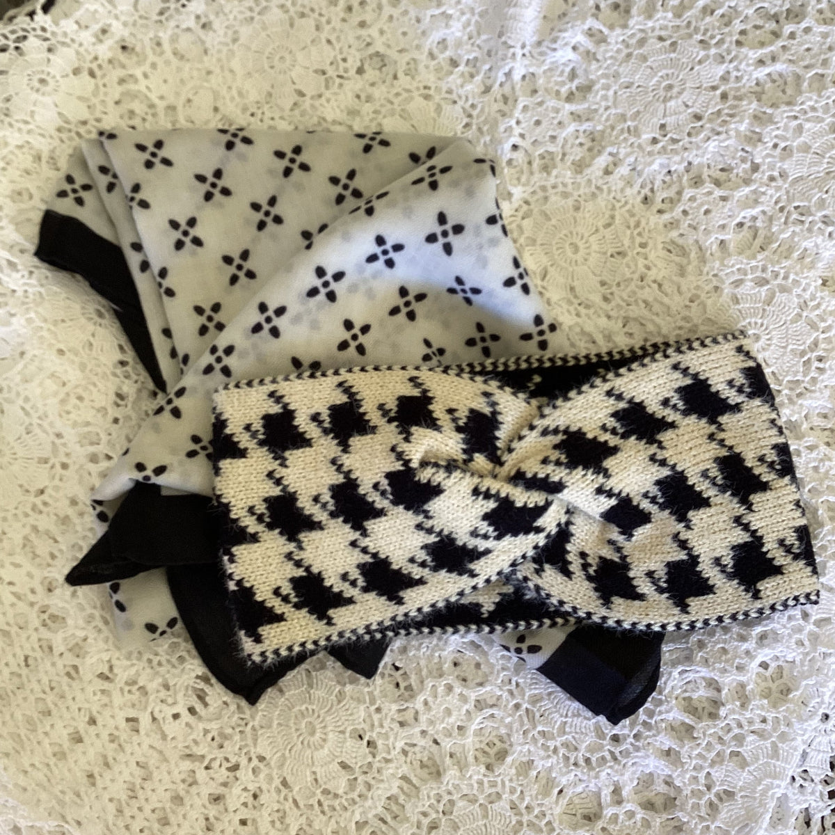 Black and whitescarf and headband on a lace background