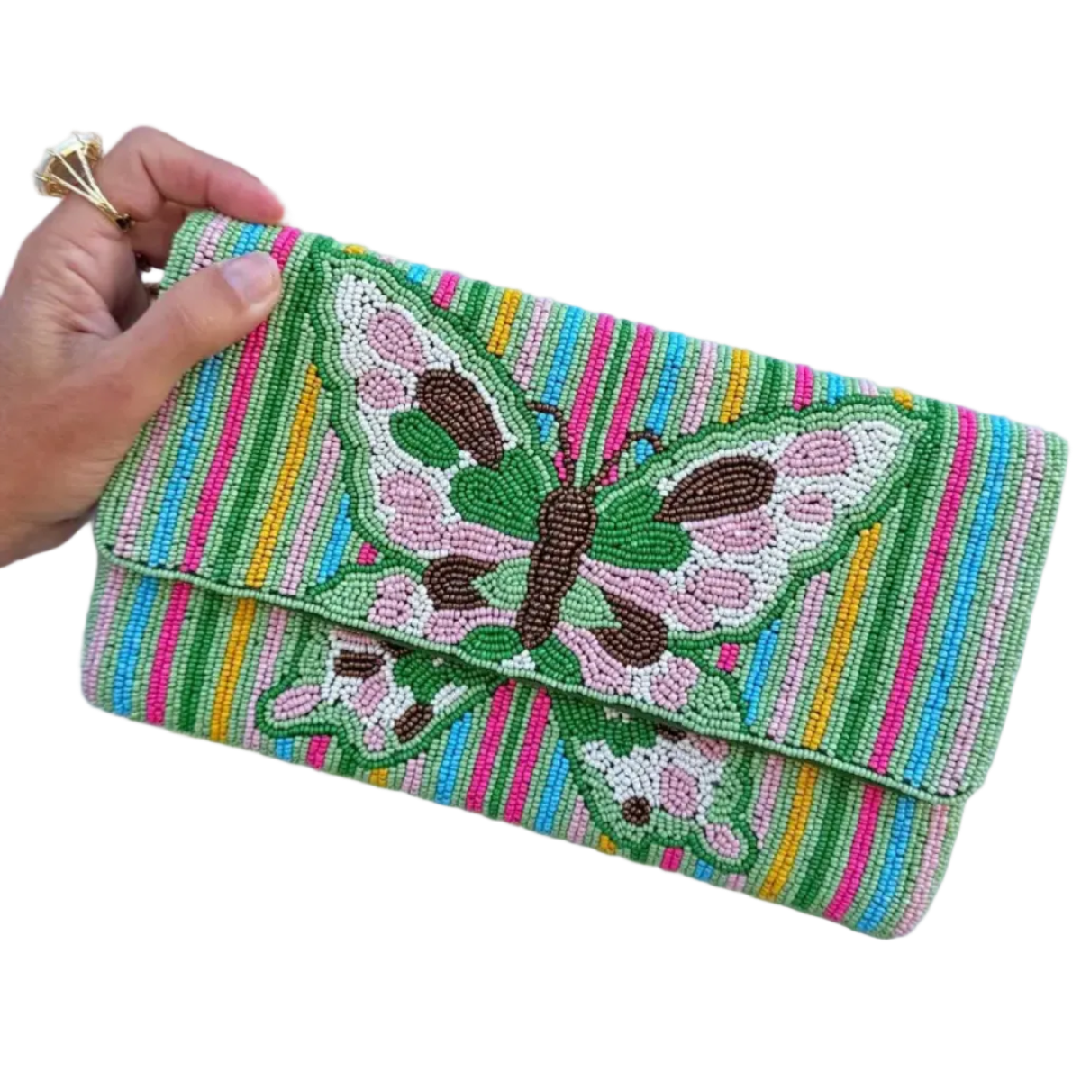 a hand holding a beaded cutch bag that has a green butterfly deign and pink, blue and green stripes