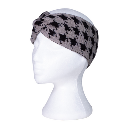 Grey knitted headband with a black houndstooth pattern on a mannequin head against a white background