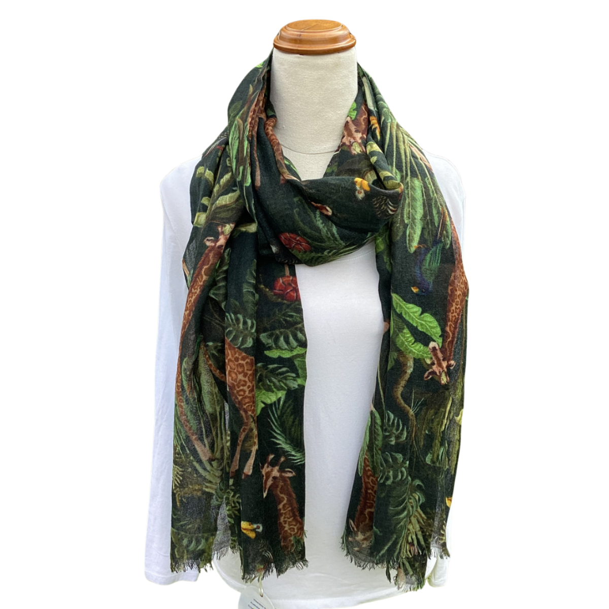 Scarf with jungle animals pattern on a mannequin against a white background