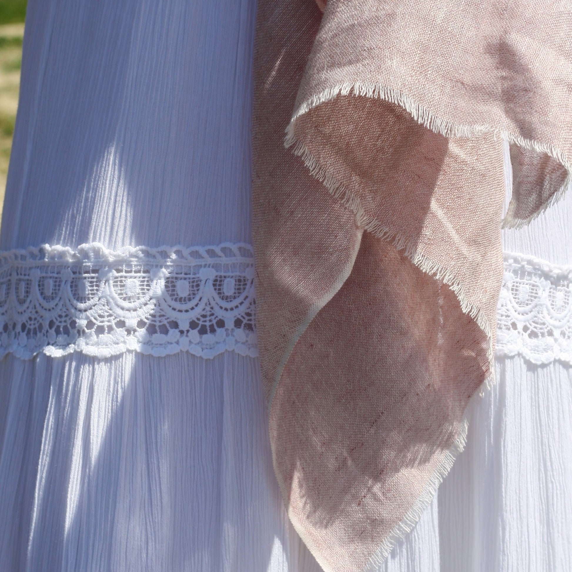 a rustic linen scarf in a dusty pink colour