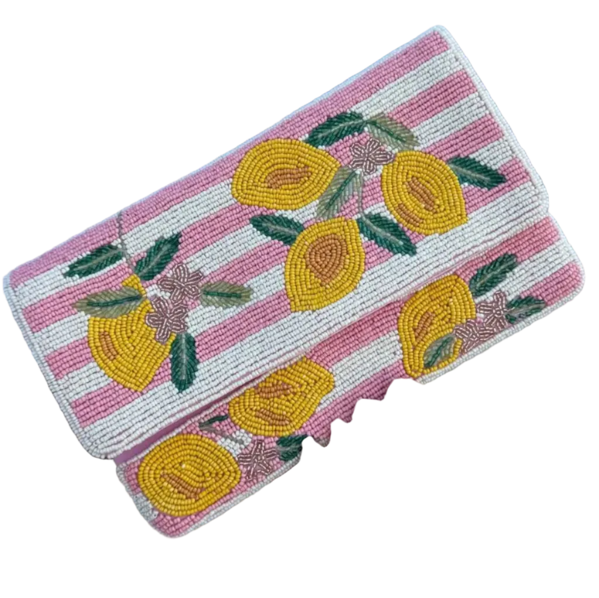 A hand holding a rectangular beaded clutch purse with a pink and white striped background and yellow lemon motifs, set against a light blue wall.