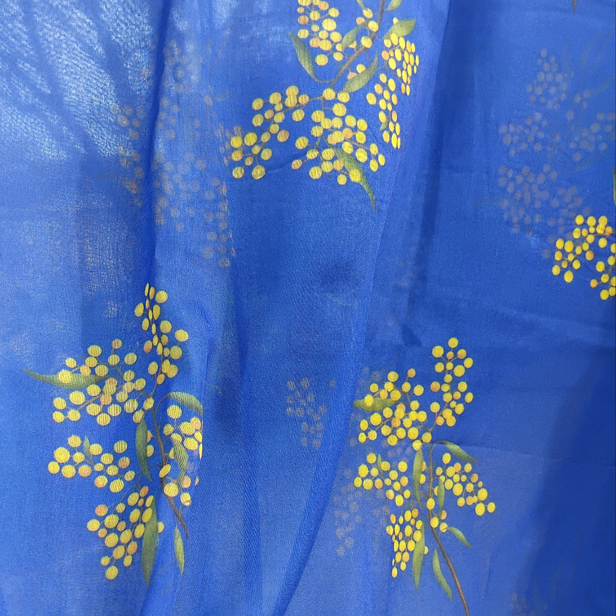 Blue scarf with yellow floral pattern