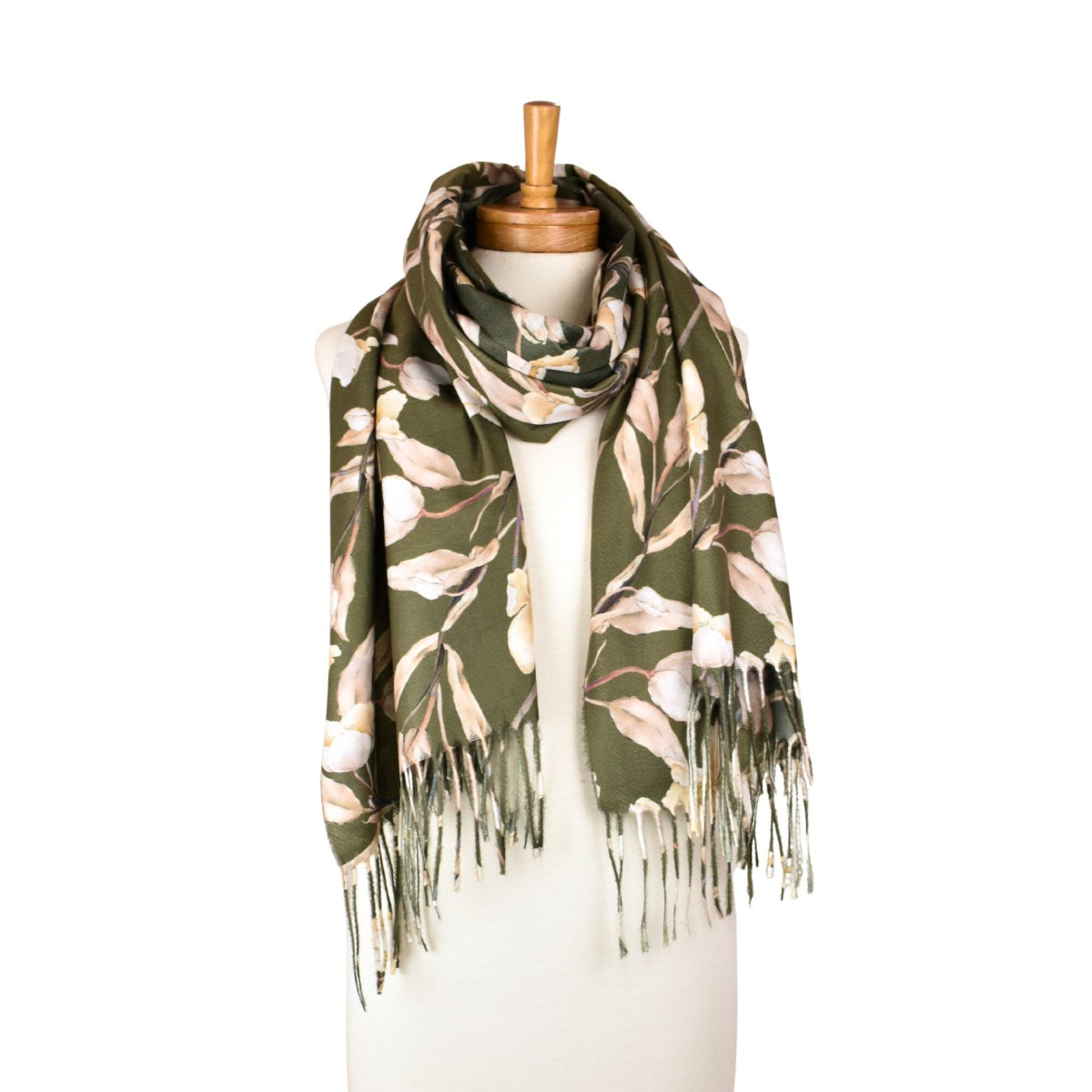 Floral patterned scarf with fringes on a mannequin against a white background