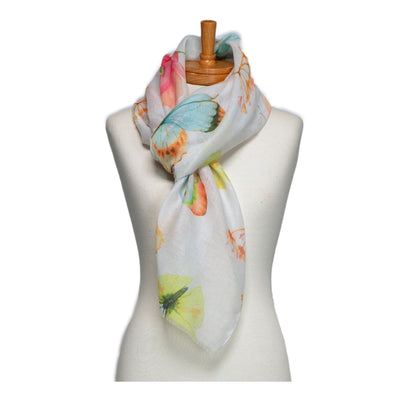 Scarf with butterfly design on a mannequin against a white background