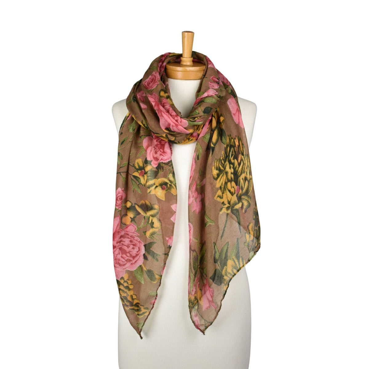 Floral patterned scarf on a mannequin against a white background