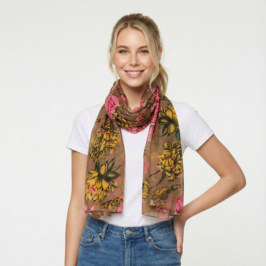 Woman wearing a floral scarf on a white background