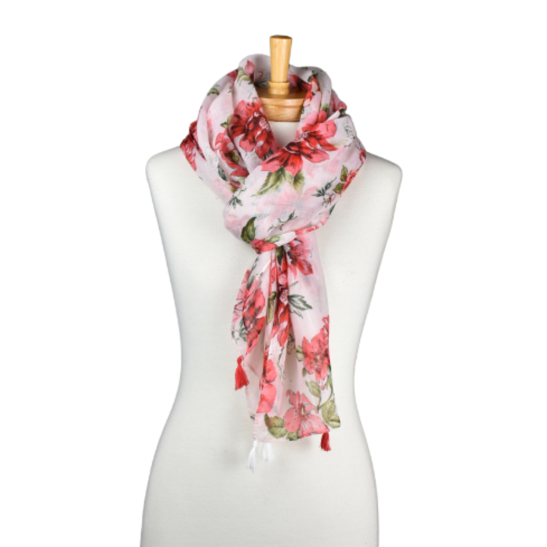 a pale pink ladies scarf with bright pink florals and tassels