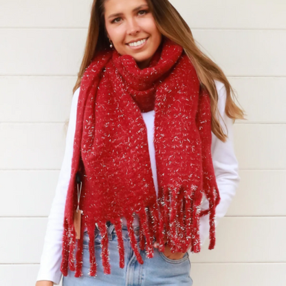 Woman wearing a red scarf with gold glitter thread and a white background