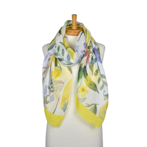 a pretty scarf that has large painted flowers and leaves in shades of purple and green and yellow lemons, finished with a pale yellow border.