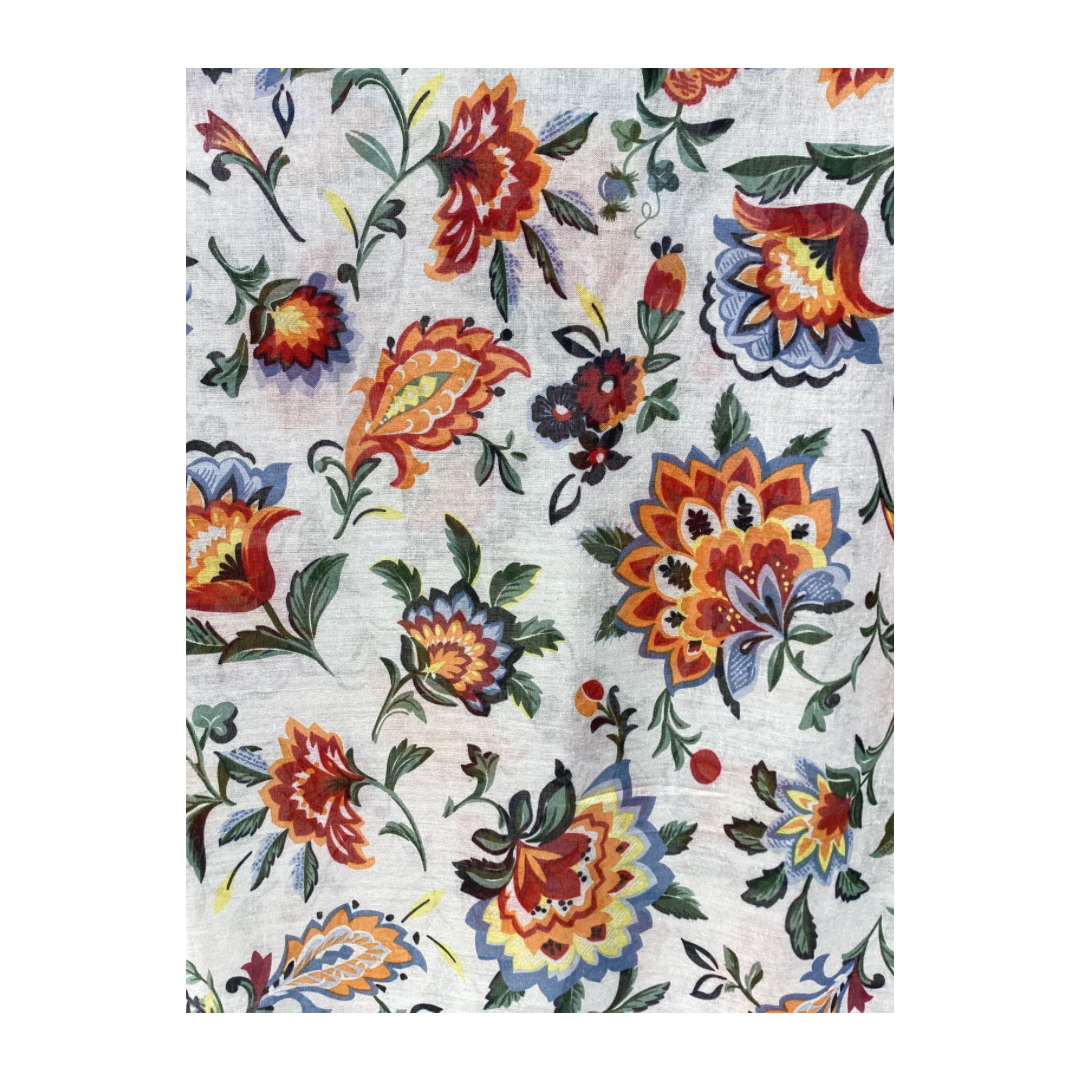 a close up picture of a floral ladies scarf that has a white background and bright red, orange  and yellow flowers and denim blue, emerald green and sage green leaves