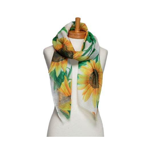 Scarf with sunflower design on a mannequin against a white background