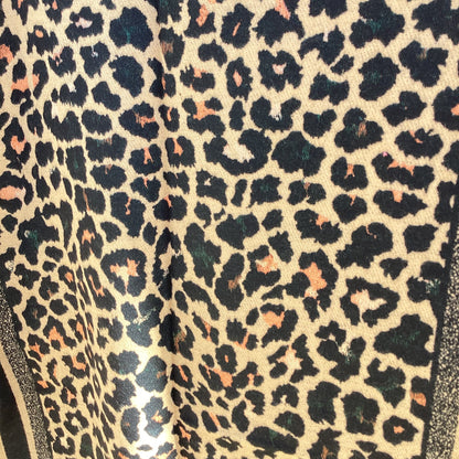 Close-up of leopard print ladies scarf with a beige background