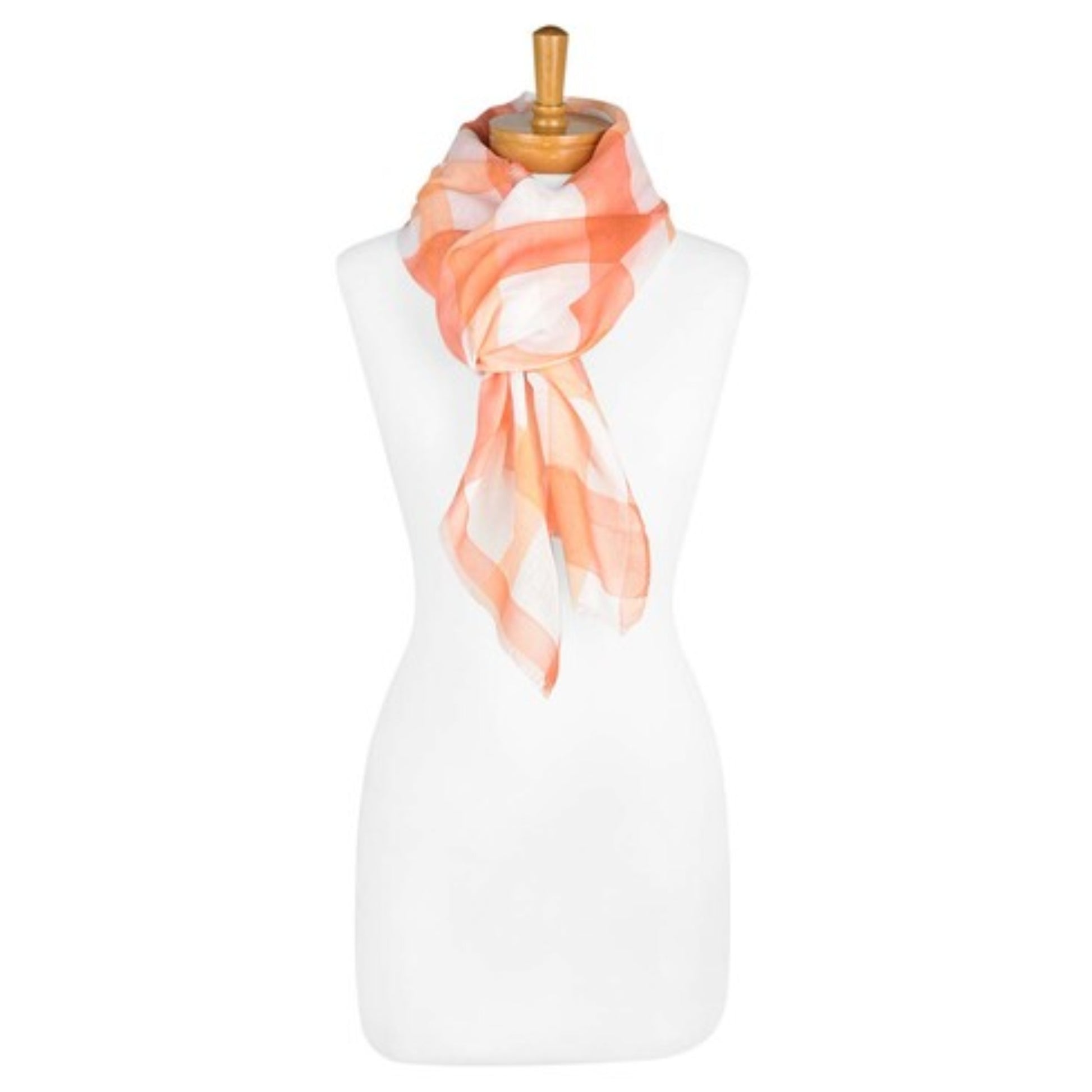 a ladies scarf that has a white background and an orange gingham pattern