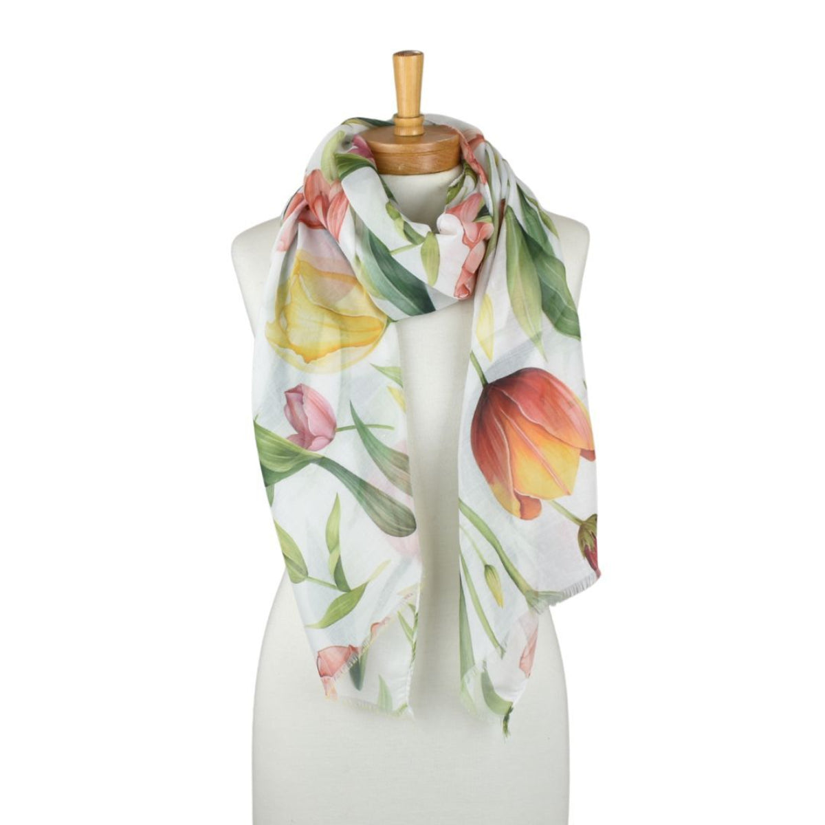 Floral scarf on a mannequin against a white background