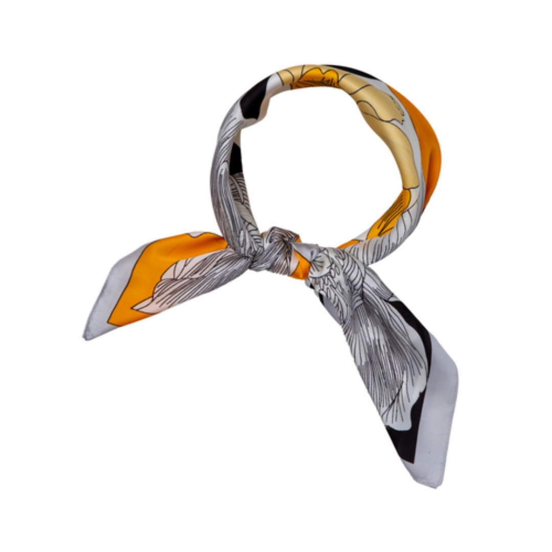 a silk feeling ladies scarf that is tied in colours of yellow, black and silver