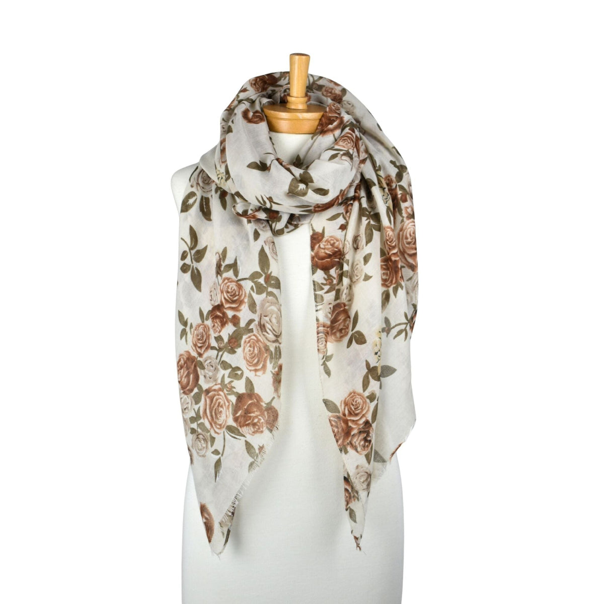 Floral patterned scarf on a mannequin against a white background