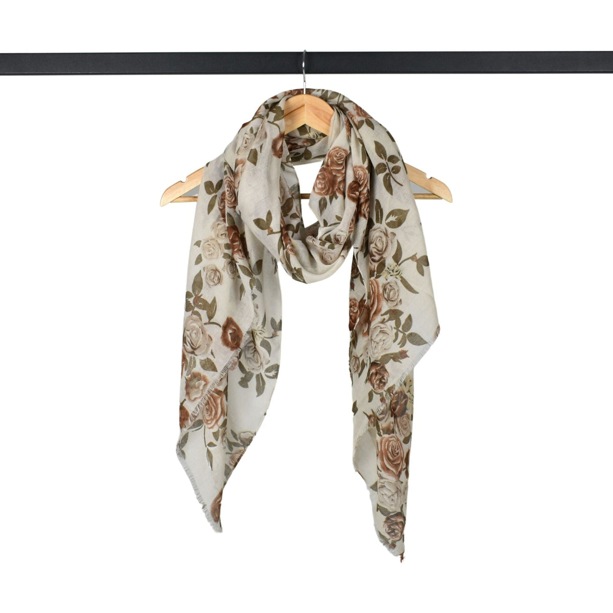 Floral patterned scarf on a hanger against a white background