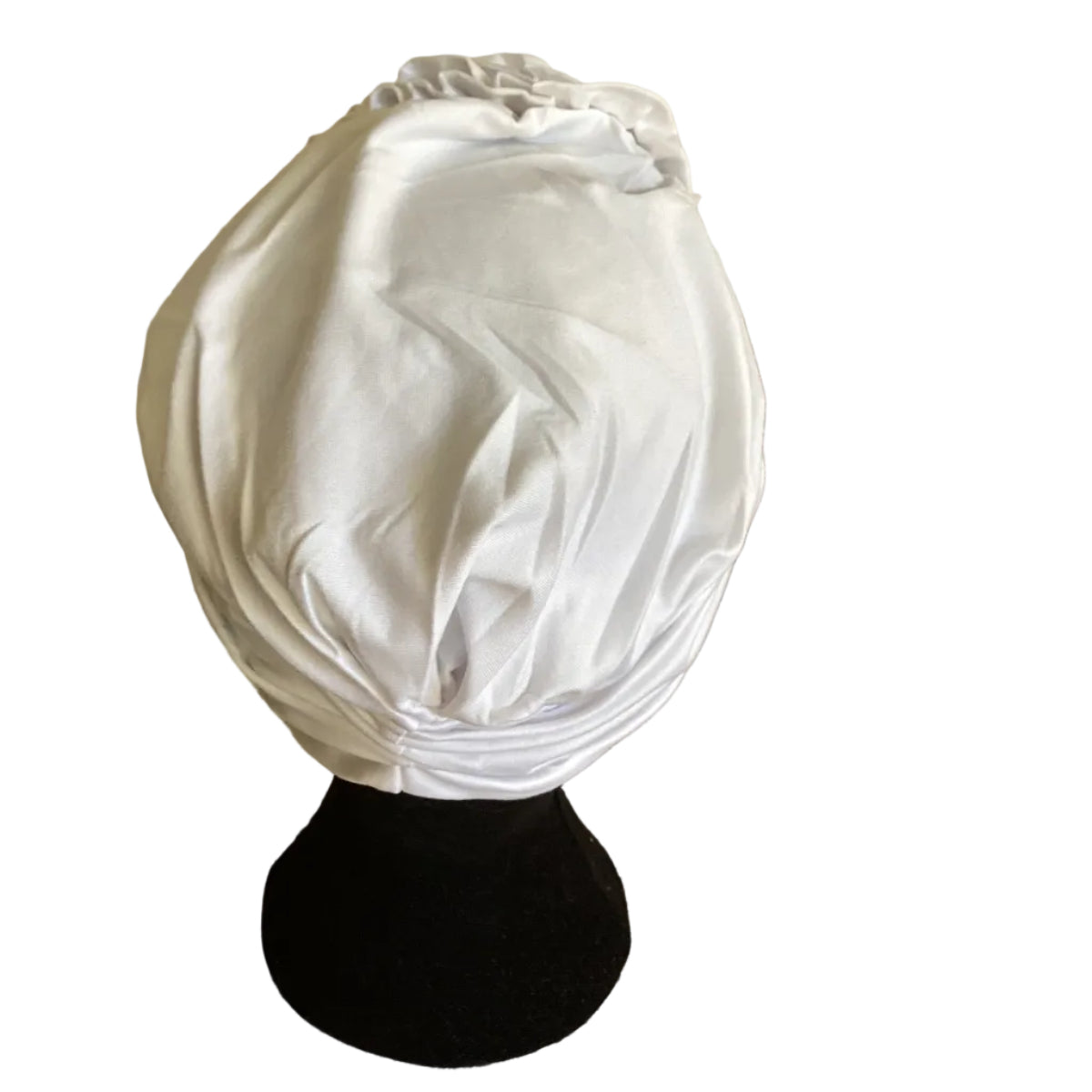 back view of a head mannequin wearing a white turban