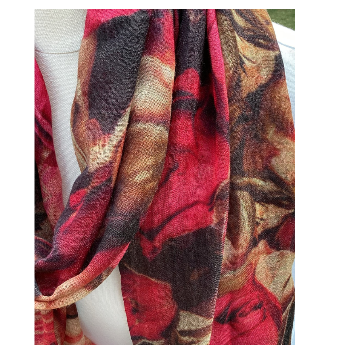 Floral patterned scarf draped over a mannequin