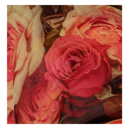 Close-up of a pink rose patterned scarf with a merino wool texture