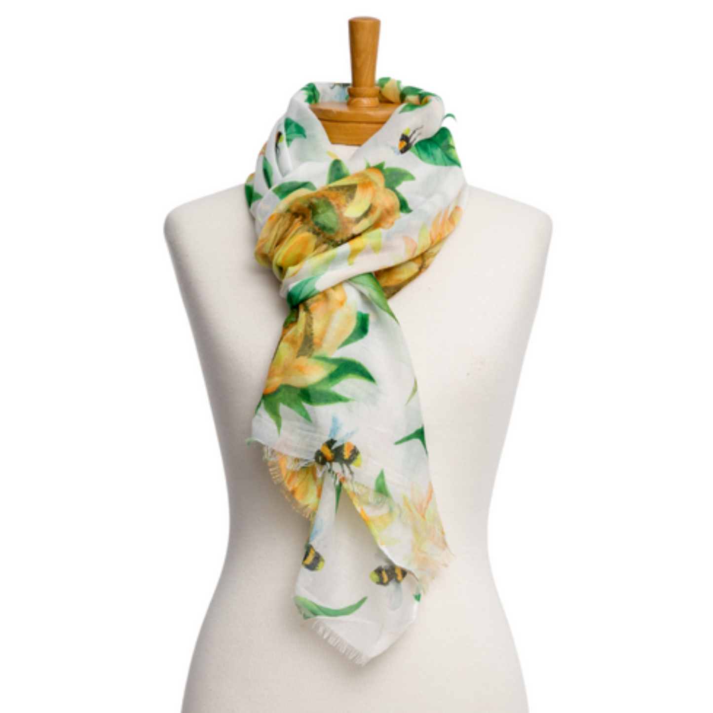 a pretty ladies scarf that has a white background, bright yellow sunflowers, yellow bumble bees and bright green leaves