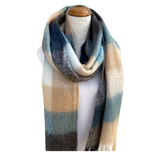 A long, soft plaid scarf draped on a white mannequin torso against a plain white background. The scarf features a muted plaid pattern with blocks of blue, beige, gray, and off-white.