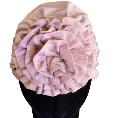 dusty pink head turban with a flower decoration