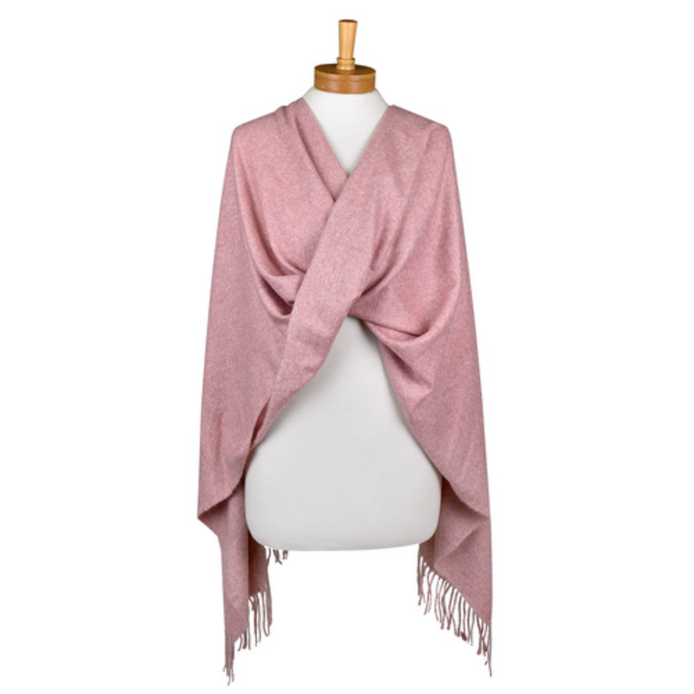 a plain dusty pink coloured scarf that has tassels and is draped around a mannequin. The scarf is very soft and warm.